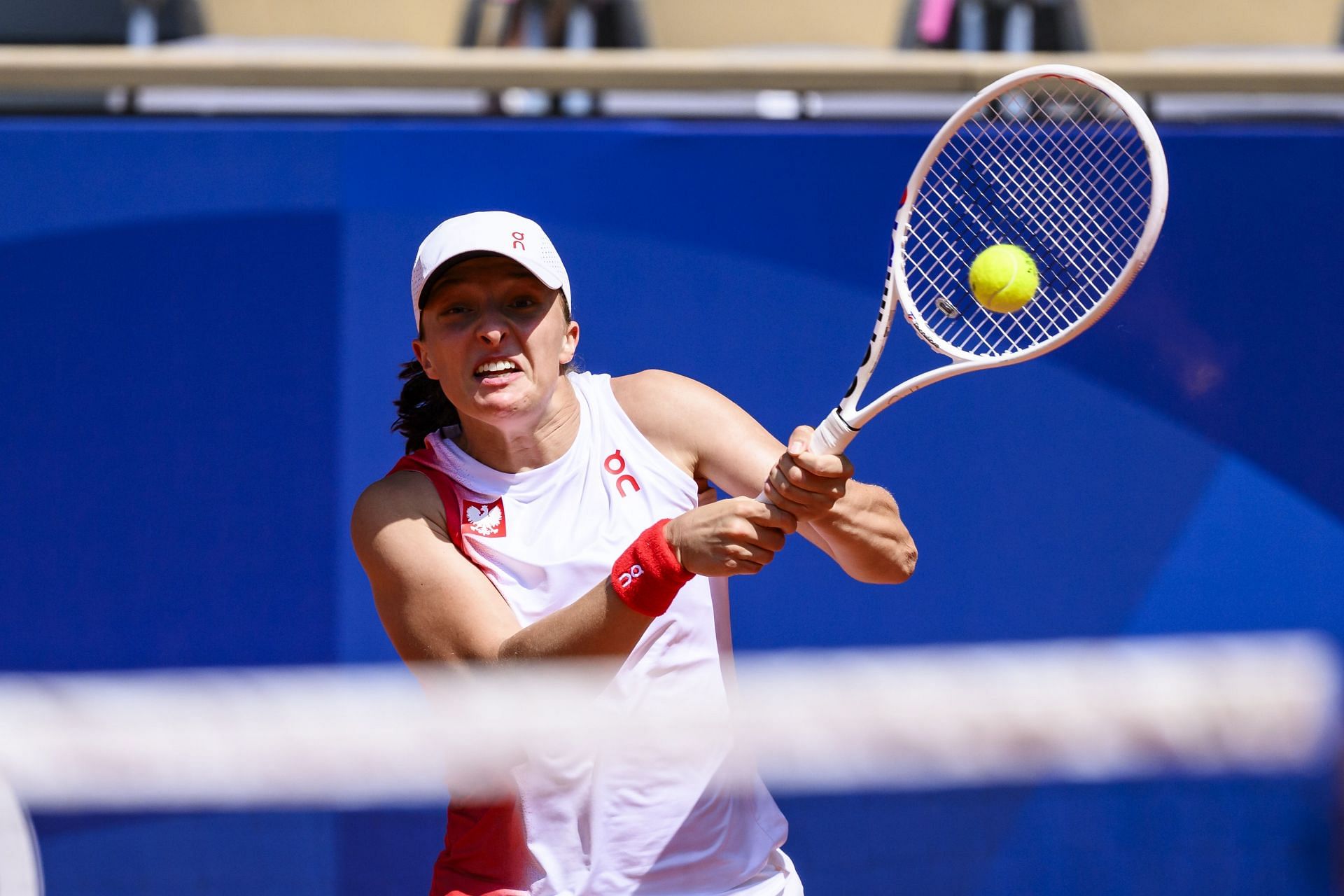 World No. 1 Swiatek hits a backhand at Paris Olympics